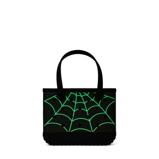 Bitty Bogg® Bag - Itsy Bitsy Glow in the DarkA black tote bag with a green spiderweb pattern printed on the front, featuring two black shoulder straps and a black textured base, shown against a plain white background.