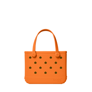 Bitty Bogg® Bag - Pieces of Pumpkin
An orange silicone tote bag with a pattern of small dark green pumpkin motifs, featuring two top handles and the embossed 'bogg' brand name on the bottom right, set against a plain white background.