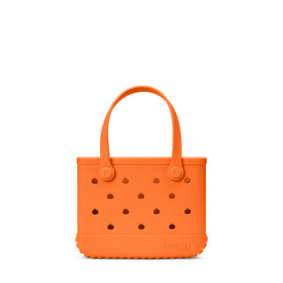 Bitty Bogg® Bag - Pieces of Pumpkin
An orange Bogg tote bag with pumpkin-shaped cutouts and dual top handles, shown against a plain white background.