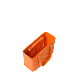 Bitty Bogg® Bag - Pieces of Pumpkin An orange silicone shopping basket bag with a zippered interior, shown from an elevated angle on a solid white background.