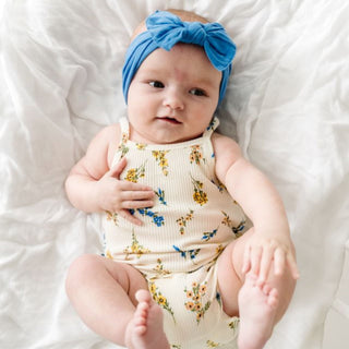 Baby Bling denim knot headband with classic style, soft fabric and adjustable knot for baby girls.