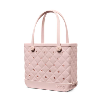 Baby Bougie Bogg® Bag - Quilted Rose Petal
Pink quilted tote bag with perforated design on a white background
