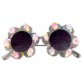 Bari Lynn Charm Embellished Flower Shape Sunglasses - Sweet Treats
Sunglasses with decorative frame featuring ice cream and donut designs on a white background