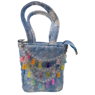 Bari Lynn quilted tie-dye denim handbag with gummy bear link charm, featuring a stylish and playful design.