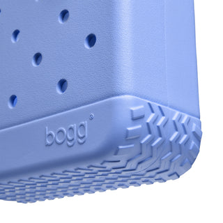 Bitty Bogg® Bag - Bogg In Bloom: Out of the Blue
Close-up of a blue bogg product with textured sole and brand name.