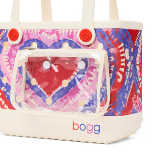 Bitty Bogg® Bag - In Love With Bogg - Buoy Red
Colorful tote bag with a heart design and 'bogg' branding on a white background
