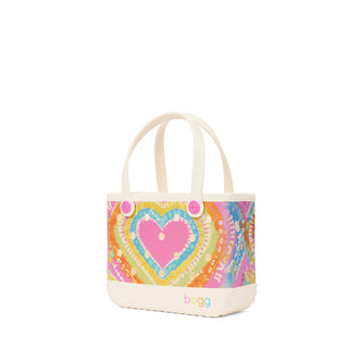 Bitty Bogg® Bag - Liquid Sunshine - Taffy
Colorful heart-patterned bag with 'bugg' branding on a white background