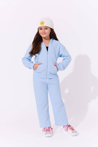 Lola and The Boys Blue Taylor Crystal Set
Child wearing a light blue tracksuit with a white beanie on a white background