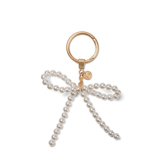 Bogg'd & Charmed - White Pearl Bow
Pearl bow keychain with gold ring on a white background