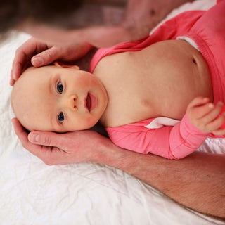Pink Bonsie Footie by Bonsie Skin to Skin Babywear featuring a cute pink design and cozy fabric for babies.