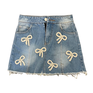 Tweenstyle Pearl Bow Denim Skirt
Denim skirt with bow decorations on a white background