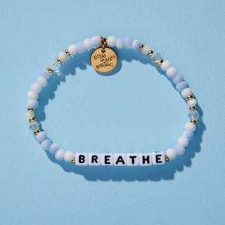 Little Words Project Bracelet - Breathe
Beaded bracelet with 'BREATHE' charm on a light blue background
