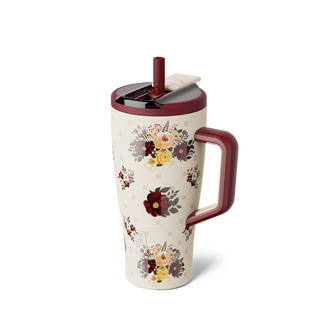 Brumate Era Flip 30oz - Quilted Florals
A tall insulated travel tumbler with a floral print, featuring a cream-colored body with multicolor bouquets, a dark red handle, and a matching dark red lid with a straw.