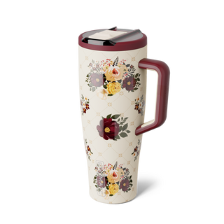 Brumate Era Flip 40oz - Quilted Florals
A travel tumbler with a cream-colored body decorated with floral bouquets and a diamond lattice pattern, featuring a dark burgundy handle and lid, and a black interior.