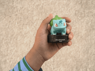 Tonies Pokémon Bulbasaur toy character, featuring detailed design and vibrant colors, ideal for children’s play and collection.