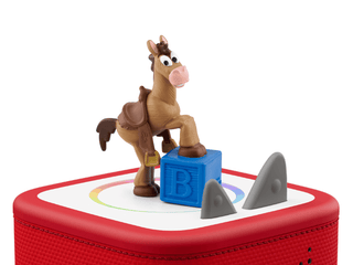Tonies Character - Disney and Pixar Toy Story 5: Bullseye
Toy horse figure on a red and white base with a blue block and gray object.