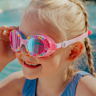 Bling2o Candy Carnival Swim Goggles
Child wearing colorful swim goggles with a pool in the background