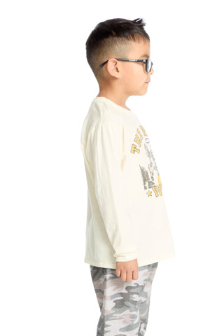 Chaser The Wild West Long Sleeve Tee
Child wearing a white long-sleeve shirt with graphics and camouflage pants on a white background