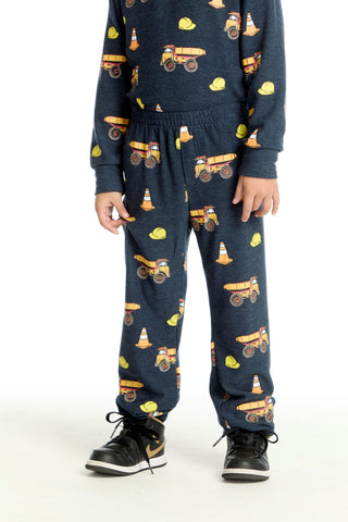 Chaser Construction Trucks Pants
Child wearing navy blue pajama set with construction vehicle pattern on a white background
