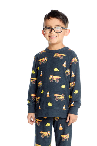 Chaser Construction Trucks Long Sleeve Pullover
Child wearing navy blue pajamas with construction vehicle pattern on a white background