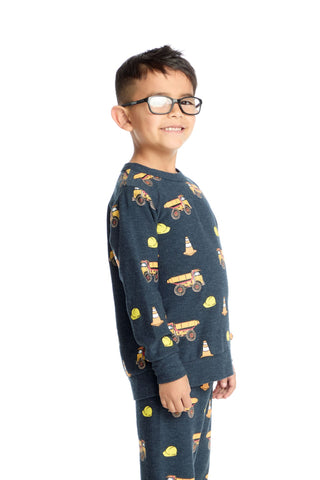Chaser Construction Trucks Long Sleeve Pullover
Child wearing a navy blue long-sleeve shirt with construction vehicle pattern on a white background