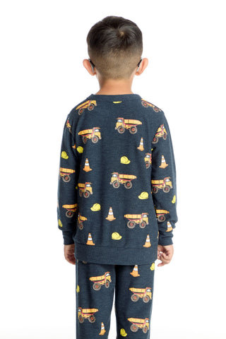 Chaser Construction Trucks Long Sleeve Pullover
Child wearing a navy blue pajama set with construction vehicle pattern on a white background