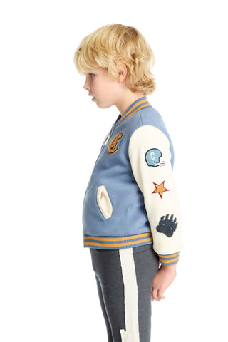 Chaser Steel Blue and Stonewash Blue Jacket Child wearing a blue and white varsity jacket with patches on a white background