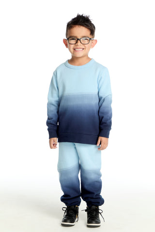 Chaser Malibu Blue Ombre Pullover
Child wearing a blue and navy gradient sweater and pants on a white background