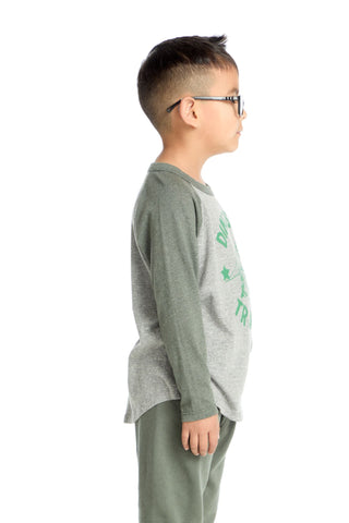 Chaser Dinosaur Trainer Long Sleeve Tee
Child wearing a gray long-sleeve shirt with green text and light gray pants on a white background
