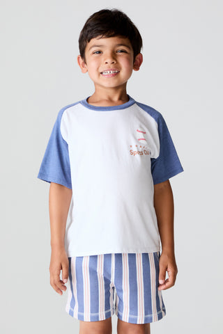 Chaser Sports Club Tee
Child wearing a blue and white baseball-style shirt with matching shorts on a plain background