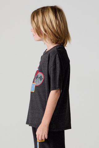Chaser Race Patches Tee
Child wearing a dark gray t-shirt with a colorful graphic on a light gray background