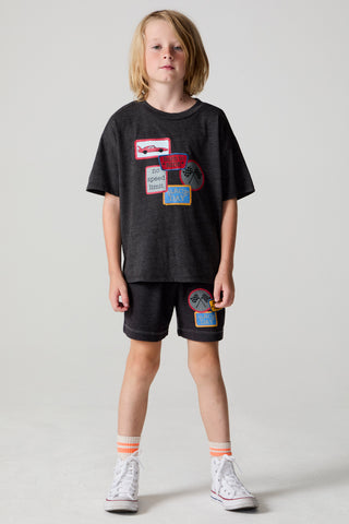 Black Chaser Race Patches Tee shirt with colorful race patch designs, casual fit, and crew neckline, displayed flat.