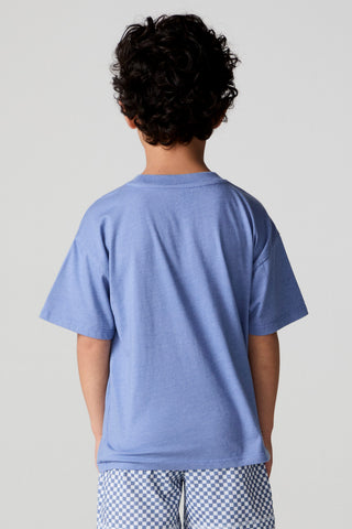 Chaser Surfin T-Rex Tee shirt featuring a playful T-Rex surfing graphic on a casual cotton fabric.