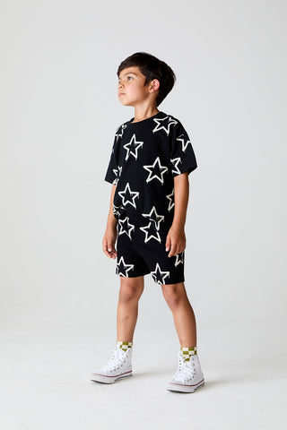 Chaser Drippy Stars shorts in black featuring colorful star patterns and a relaxed fit, perfect for casual wear.