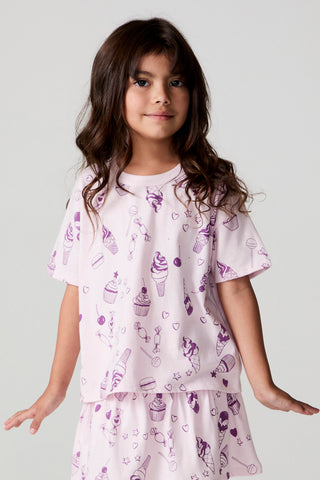Chaser Allover Sweets Tee shirt with colorful candy print, casual fit, and crew neckline, displayed on a hanger.