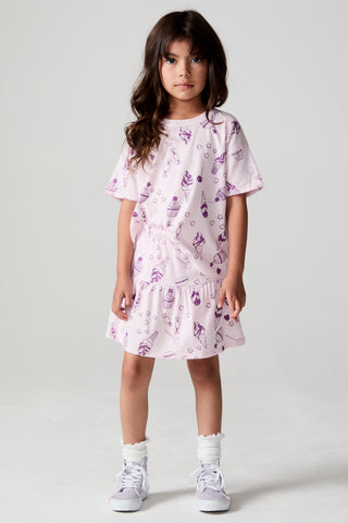 Chaser allover sweets print skort with plaid pattern, front pockets, and tie waist detail, casual and stylish for everyday wear.