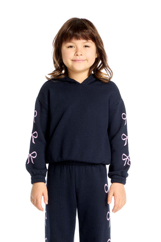 Chaser Semi Cropped Shirred Stormy Bows Hoodie Pullover
Child wearing a navy blue hoodie and pants with white patterns on a white background