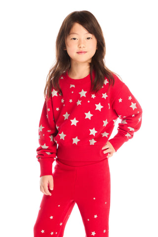 Chaser Danni Rouge Star Pullover 
Child wearing a red pajama set with white star patterns on a white background