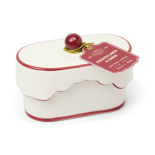 Paddywax Chérie 5.5 oz Ceramic Candle - French Linen & Orris
Decorative candle shaped like a cake with a cherry on top and a label on a white background