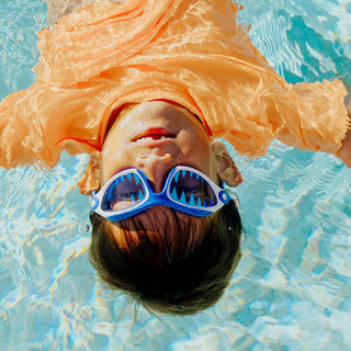 Bling2o Covert Chomp Shark Swim Goggles
Child wearing blue goggles underwater in a pool