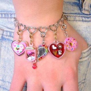 Charm It! Heart Chain Link Bracelet - Silver
Bracelet with colorful charms on a person's wrist against a denim background
