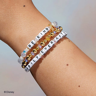 Little Words Project Bracelet - Disney Princess: Cinderella
Two beaded bracelets on a wrist with motivational phrases, featuring gold and clear beads.