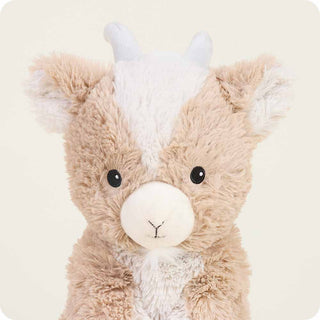 Goat Warmies
Plush toy resembling a creature with a brown body, white face, and gray horns on a beige background