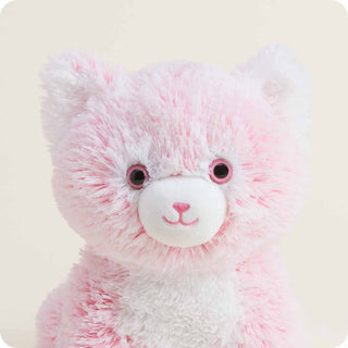 Pink Kitten Warmies
Close-up of a pink and white teddy bear on a light background