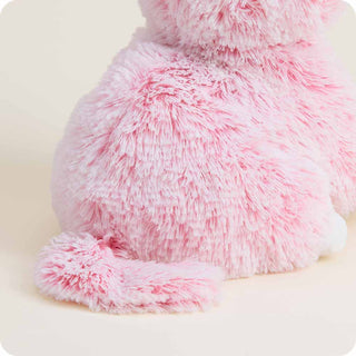Pink Kitten Warmies
Close-up of a pink and white fluffy pillow on a light background