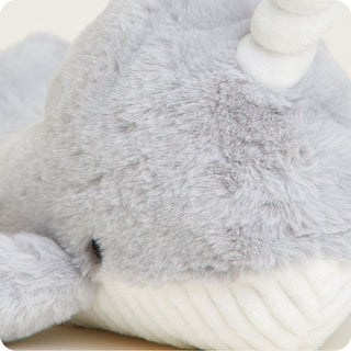 Narwhal Warmies
Close-up of a gray plush toy with white accents on a light background