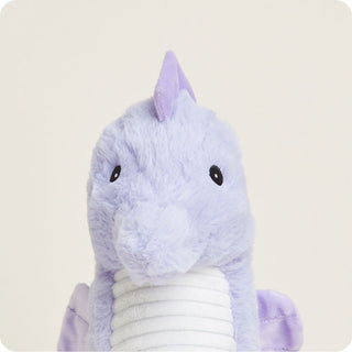 Seahorse Warmies
Plush dragon toy with purple fur on a light beige background