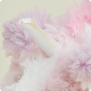 Pink Unicorn Warmies
Close-up of a fluffy pink and white object with a shiny handle on a light background