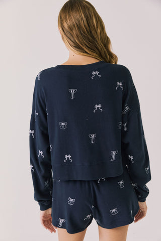 Chaser Tossed Bows Women's Long Sleeve
Navy blue pajama set with white bow pattern on a plain background