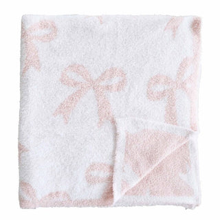 Light pink Caden Lane Cuddlelane Luxe Blanket with bow design, soft and cozy for baby or toddler use.